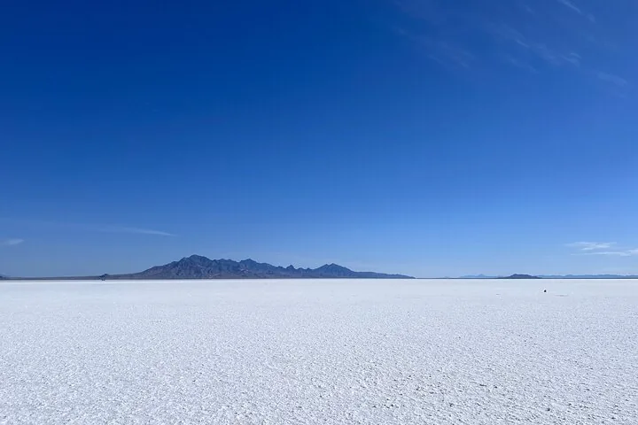 Expansive view of the Bonneville Salt Flats with mountains in distance