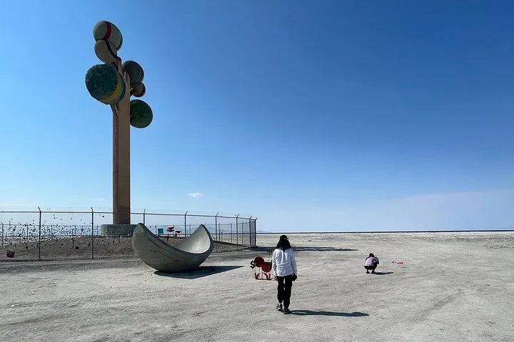 Metaphor: The Tree of Utah and concrete sphere on the flats